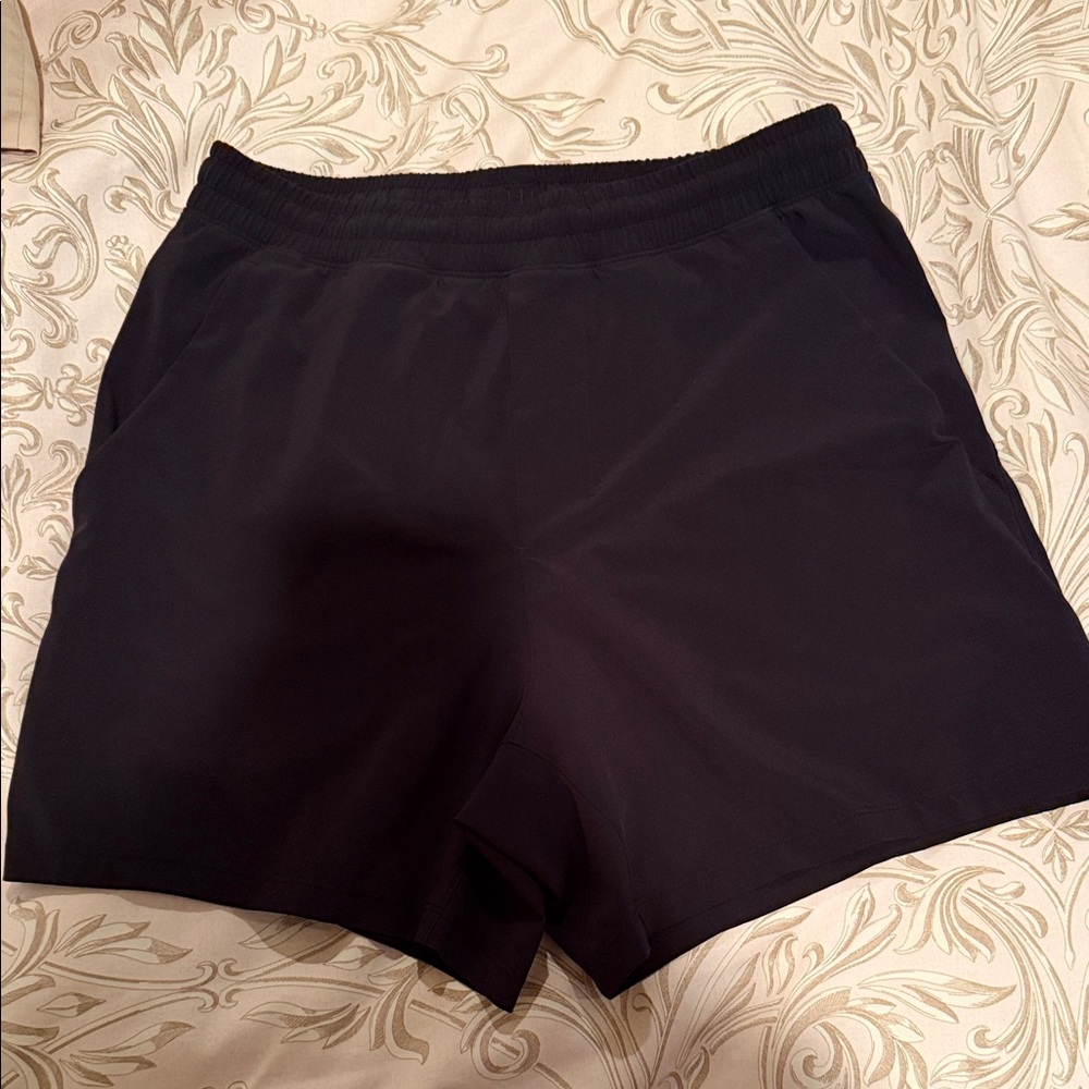 Linerless men’s black lululemon pace breaker short. Size Medium.